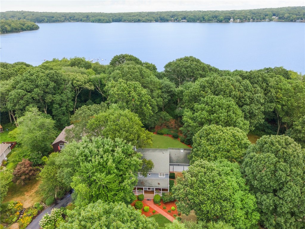 253 Table Rock Road South Kingstown, RI 02879 - Photo 29 of 44 There is a lake view through the trees.