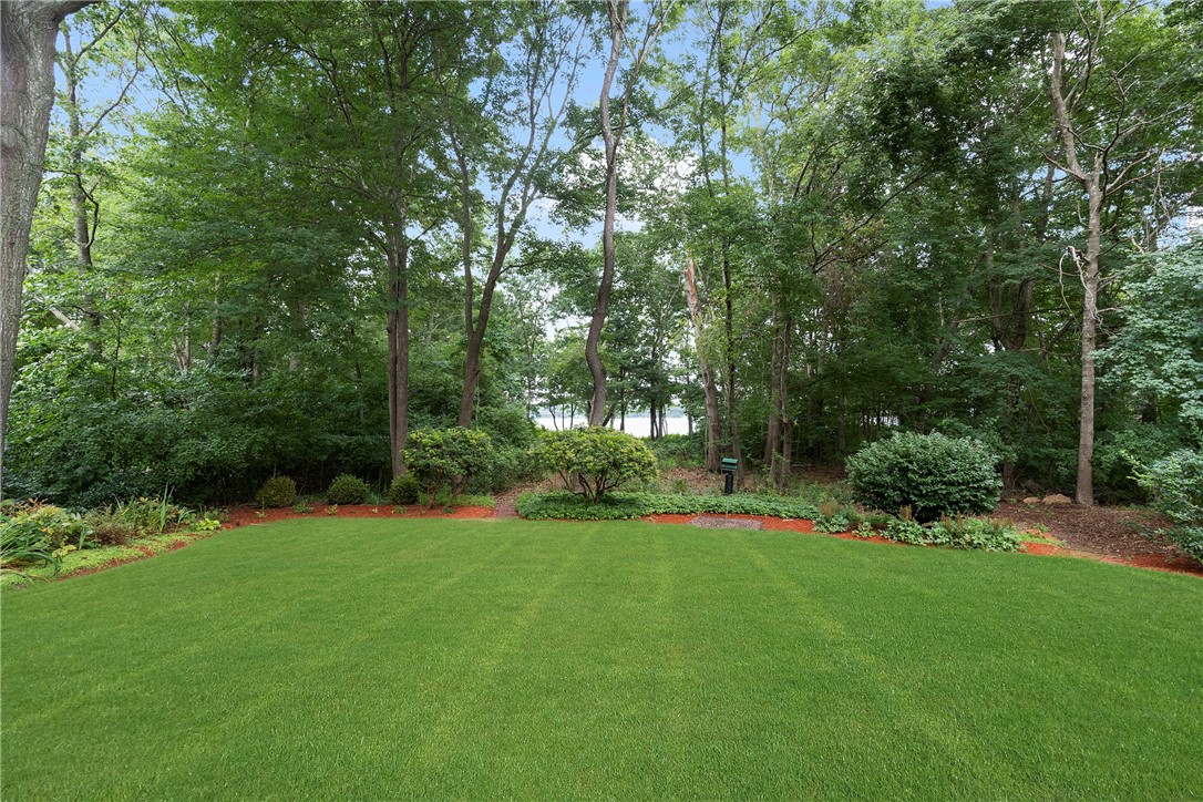 253 Table Rock Road South Kingstown, RI 02879 - Photo 35 of 44 Back Yard. Note Lake in background.
