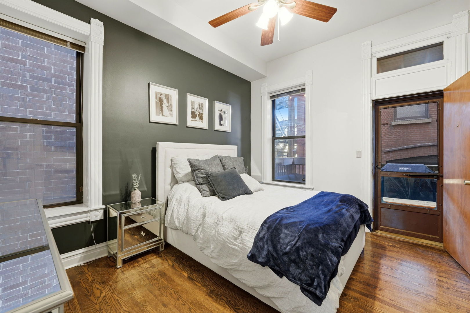 2142 North Racine Avenue, Unit 1 Chicago, IL 60614 - Photo 11 of 30 a bedroom with a bed and a ceiling fan