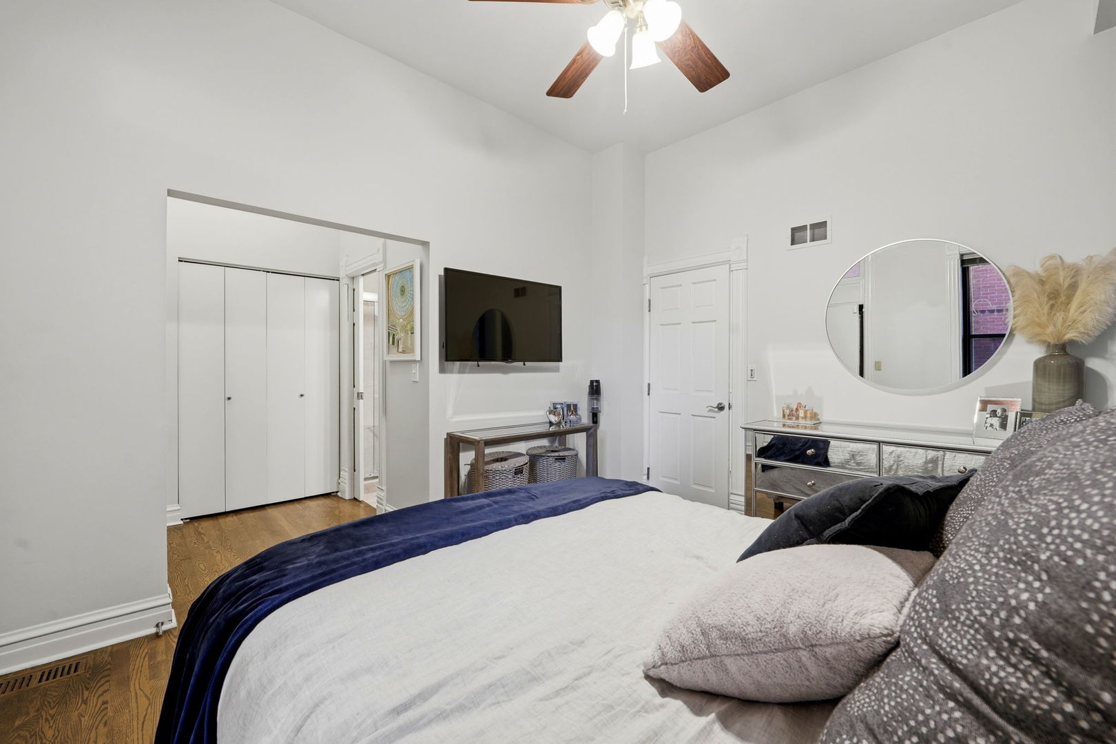 2142 North Racine Avenue, Unit 1 Chicago, IL 60614 - Photo 13 of 30 a bedroom with a bed and a flat screen tv