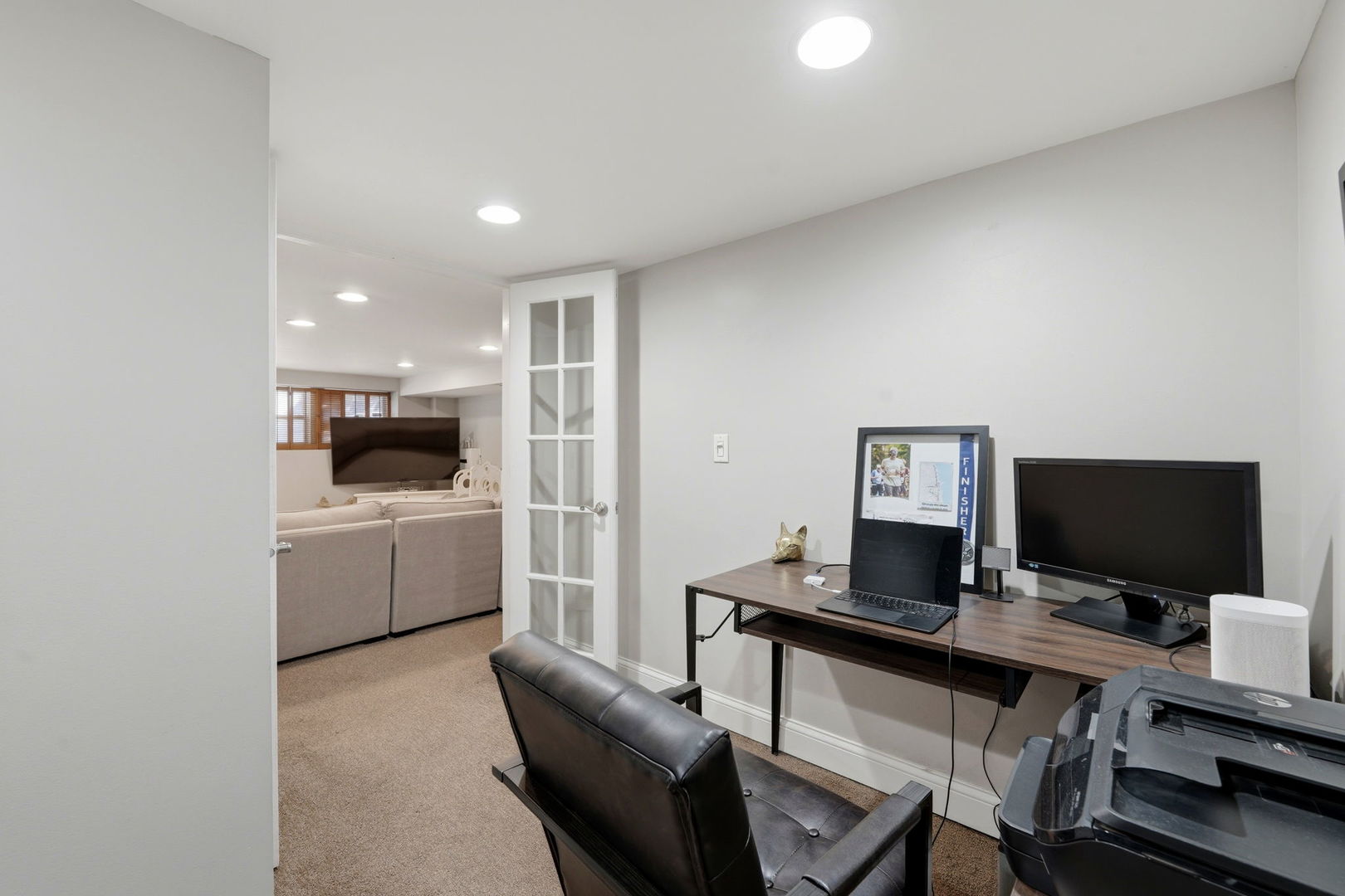 2142 North Racine Avenue, Unit 1 Chicago, IL 60614 - Photo 24 of 30 a living room with furniture and a flat screen tv