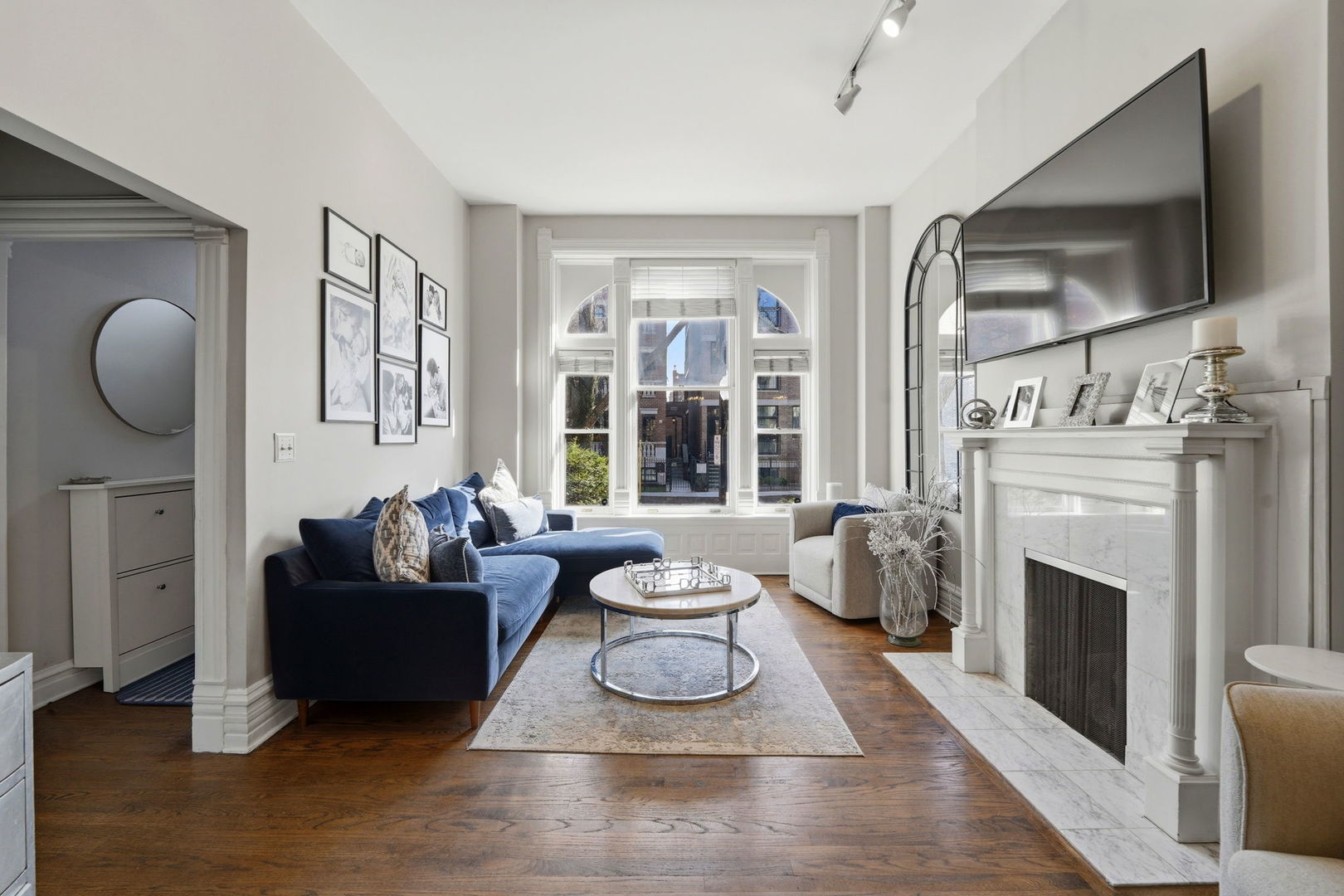 2142 North Racine Avenue, Unit 1 Chicago, IL 60614 - Photo 3 of 30 a living room with furniture a flat screen tv and a fireplace