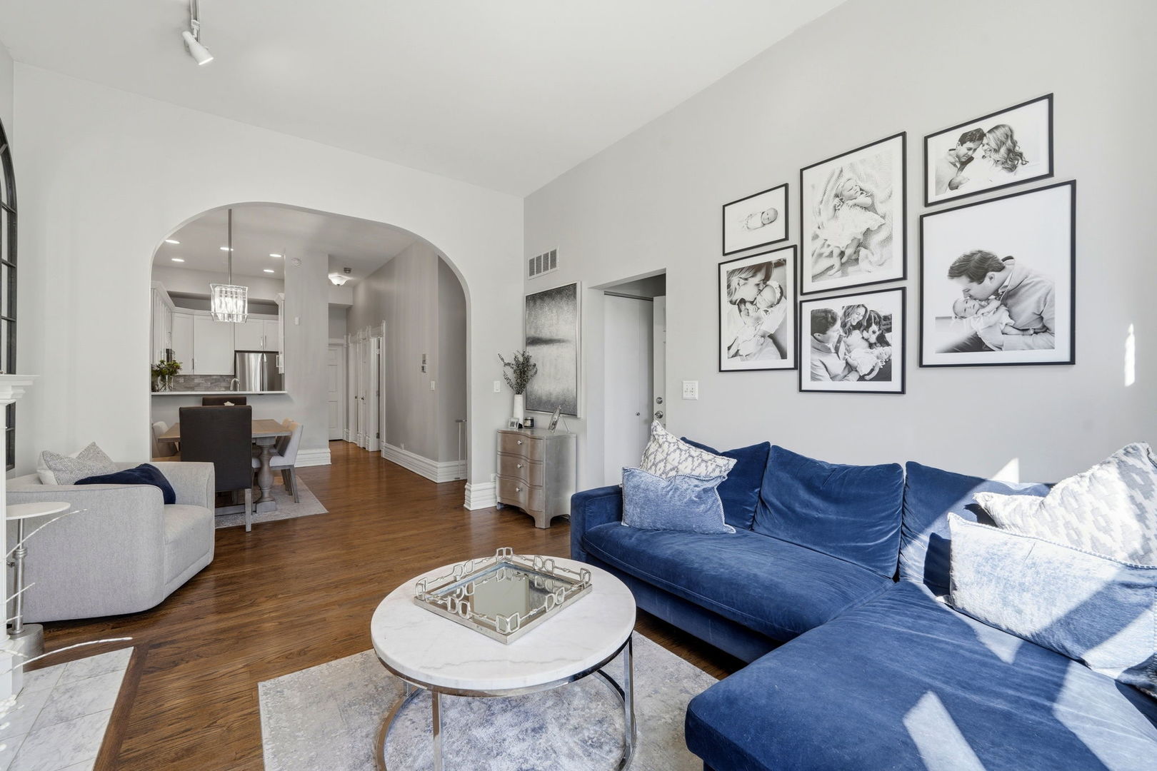 2142 North Racine Avenue, Unit 1 Chicago, IL 60614 - Photo 5 of 30 a living room with furniture a table and wooden floor