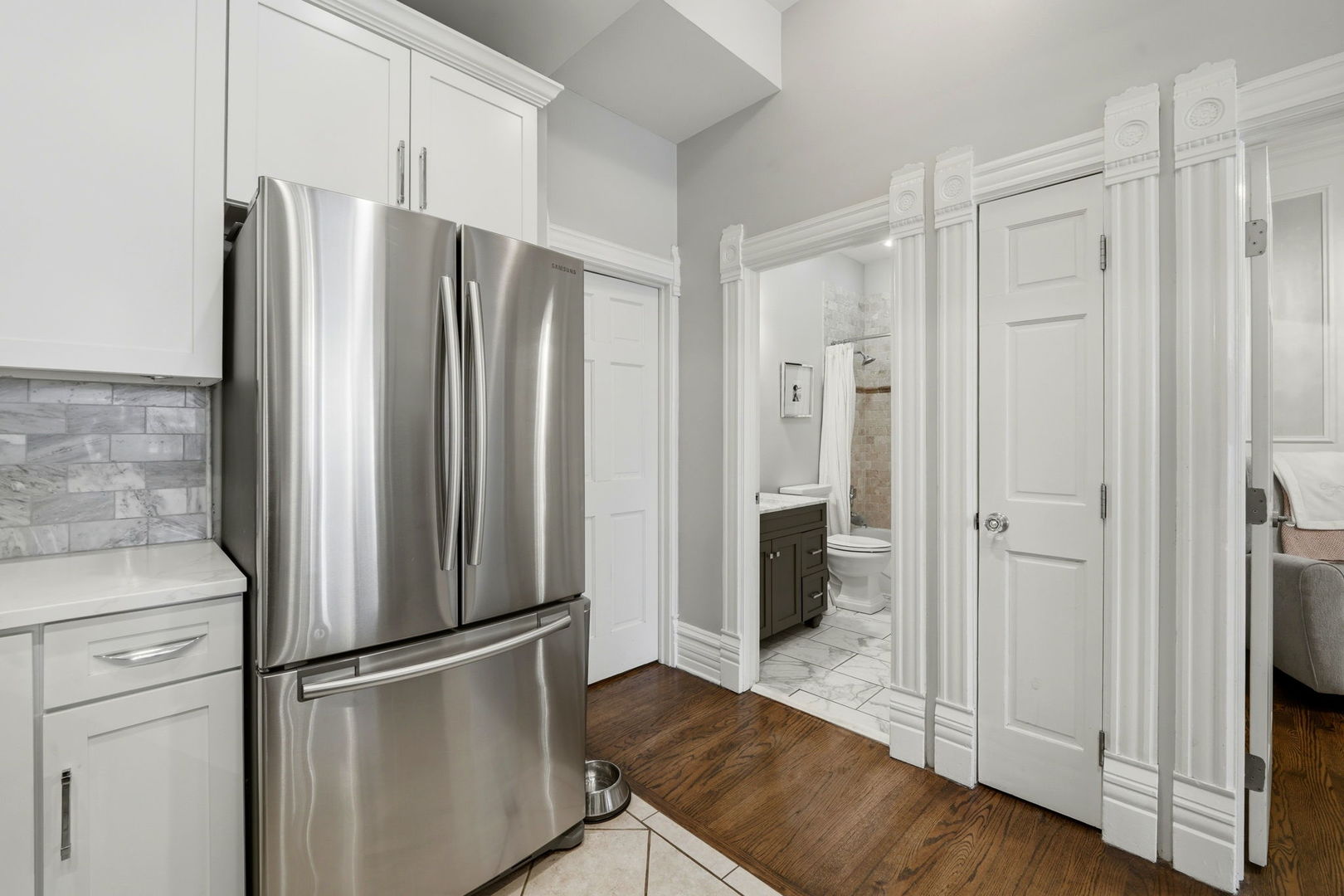 2142 North Racine Avenue, Unit 1 Chicago, IL 60614 - Photo 10 of 30 a metallic refrigerator freezer sitting in a kitchen