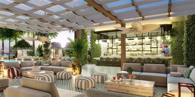 a outdoor living space with couch and a potted plant