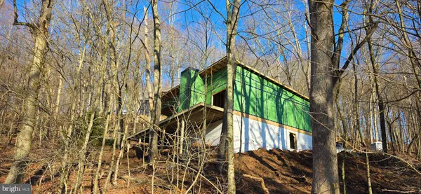 a view of a house with a tree