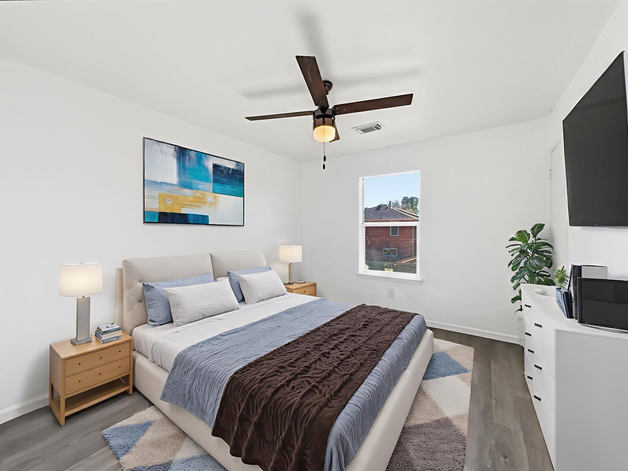 4907 Fox Mill Lane Spring, TX 77389 - Photo 12 of 18 a bedroom with a bed and a flat screen tv