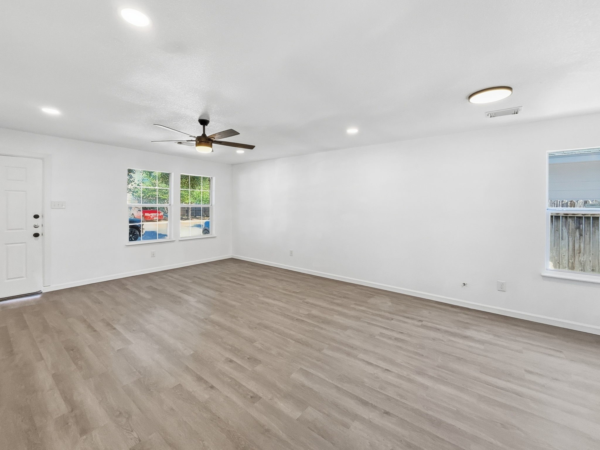 4907 Fox Mill Lane Spring, TX 77389 - Photo 4 of 18 an empty room with a empty space and windows