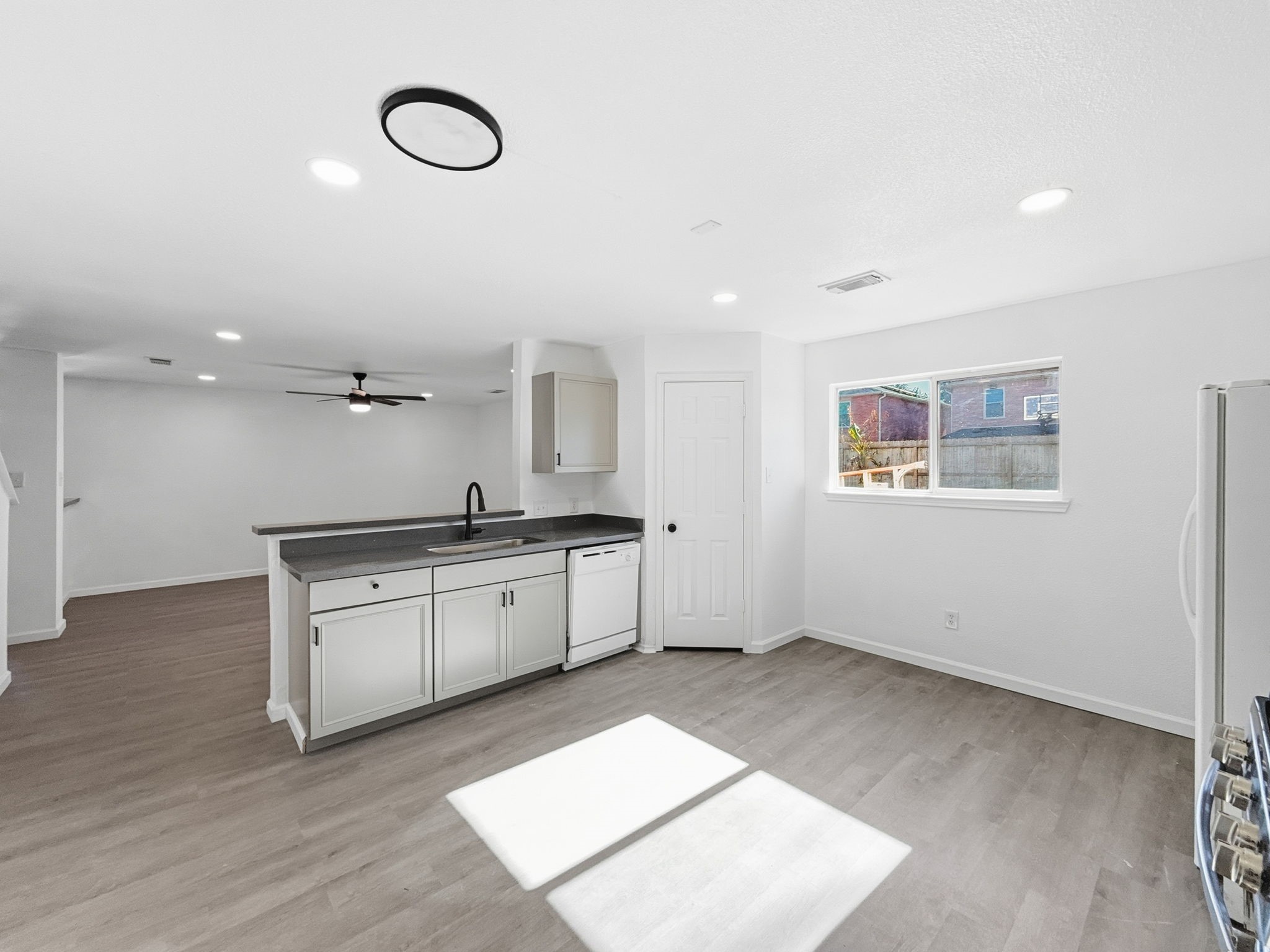 4907 Fox Mill Lane Spring, TX 77389 - Photo 7 of 18 a large white kitchen with a sink