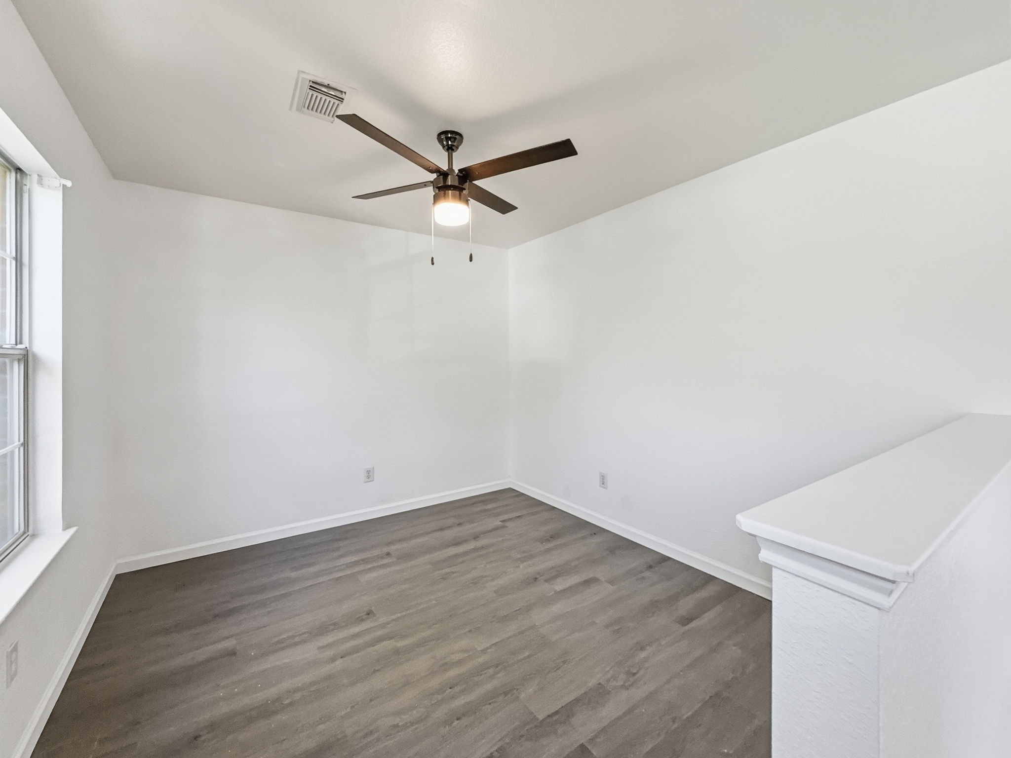 4907 Fox Mill Lane Spring, TX 77389 - Photo 10 of 18 an empty room with wooden floor and windows