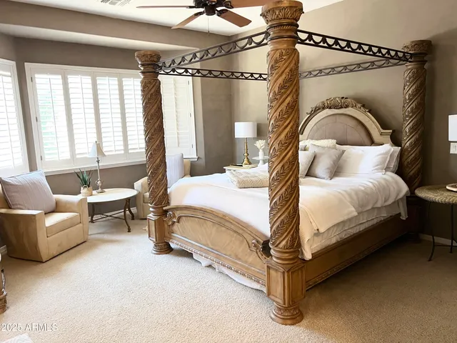 a bedroom with a bed and a couch