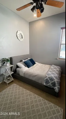 a bedroom with a bed and cabinets