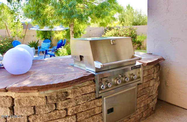a stove top oven sitting inside of a kitchen