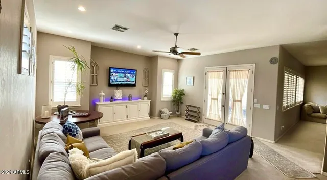 a living room with furniture and a large window