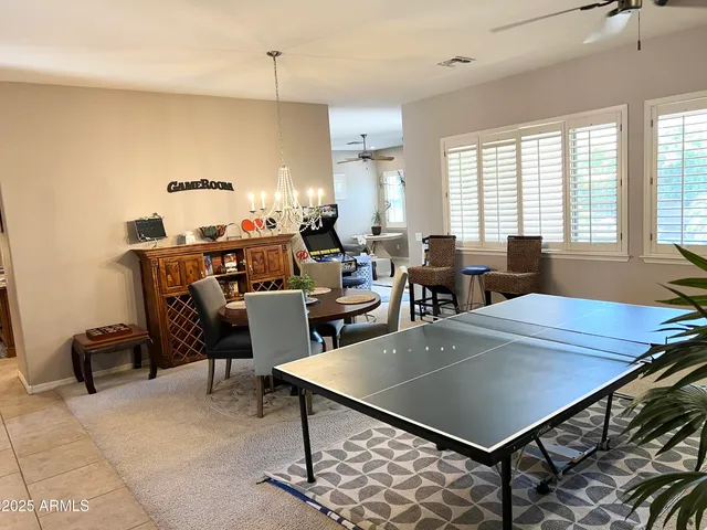 a living room with furniture a rug and a window