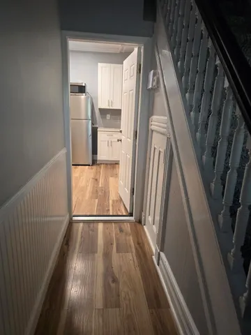 a view of wooden floor in a kitchen