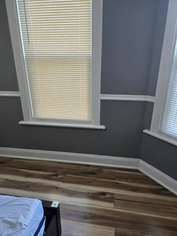 a bathroom with a window and a shower