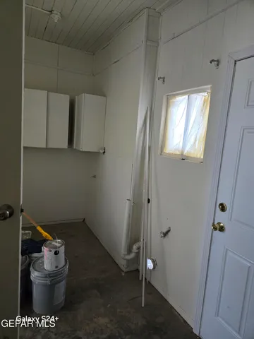 a bathroom with a toilet sink vanity and mirror