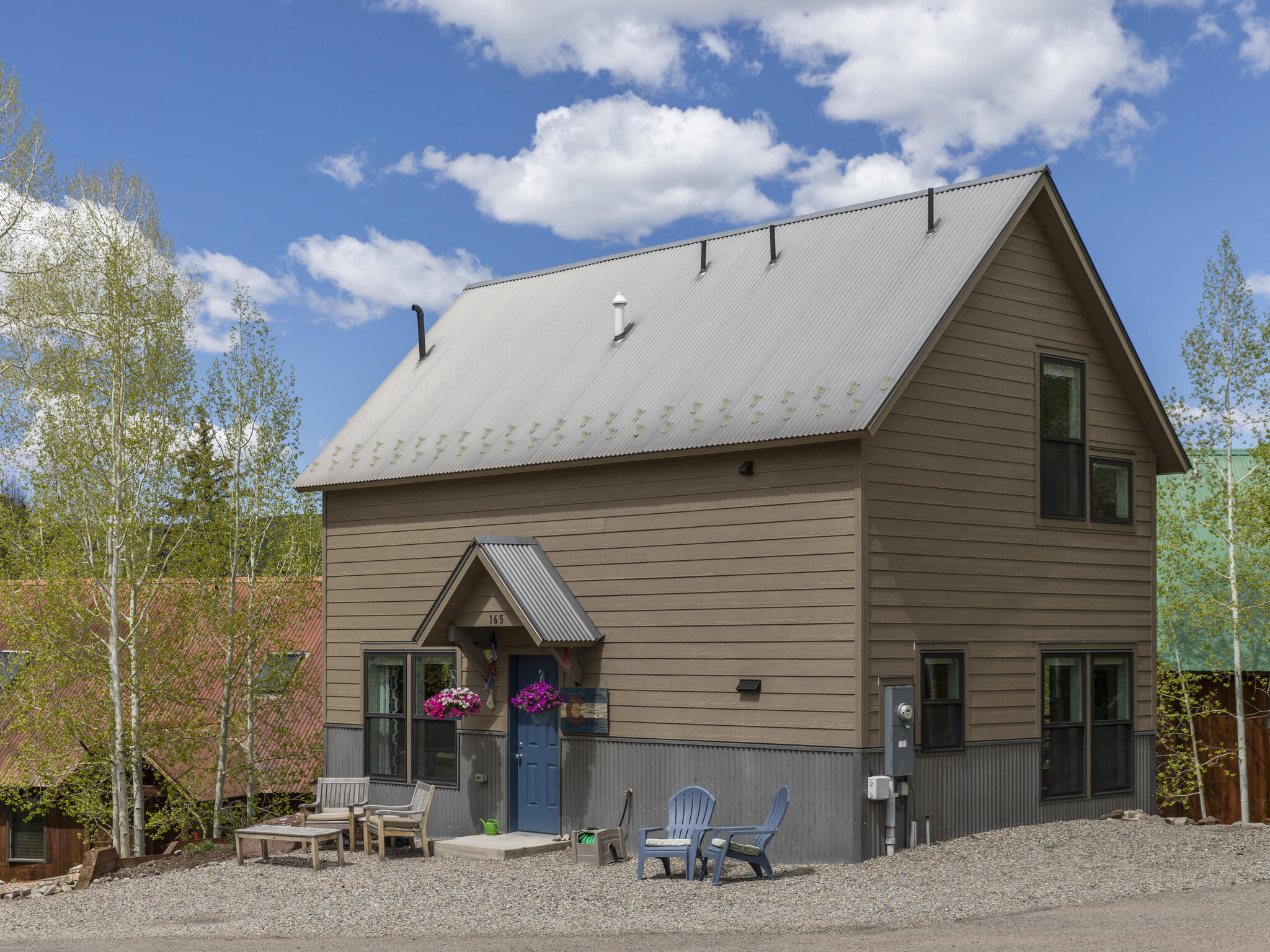 165 Alexander Overlook Telluride, CO 81435 - Photo 21 of 27 a front view of a house with garage