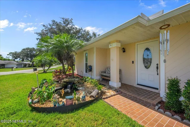 a view of a house with a garden