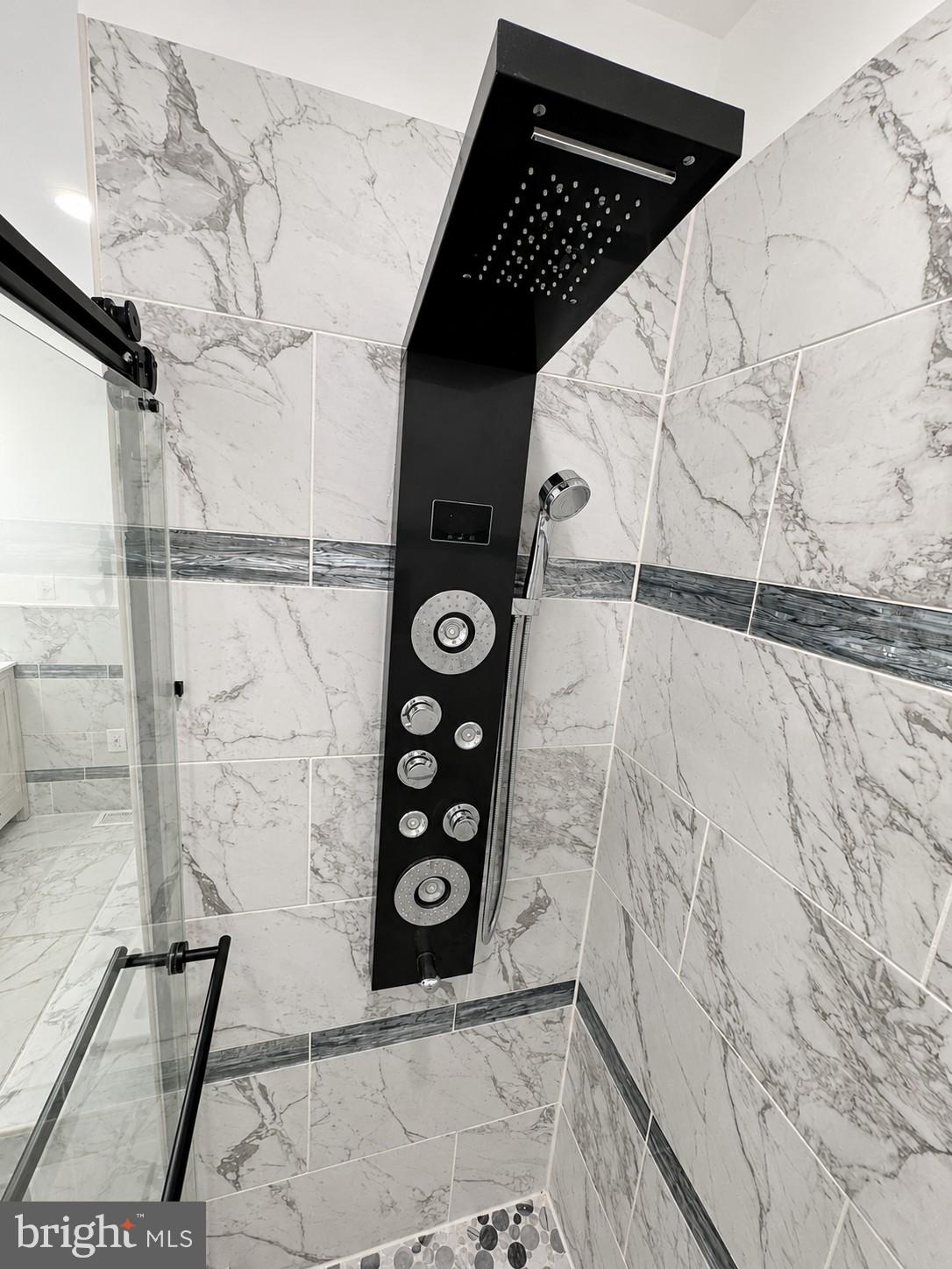 1610 Federal Street Baltimore, MD 21213 - Photo 15 of 27 Sleek shower design with modern elegance.