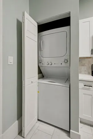 a utility room with dryer and washer