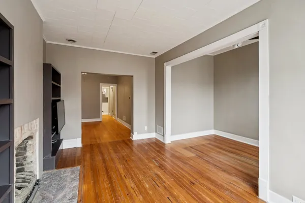 a view of hallway with wooden floor