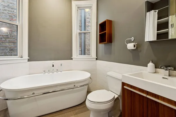 a bathroom with a sink toilet and mirror