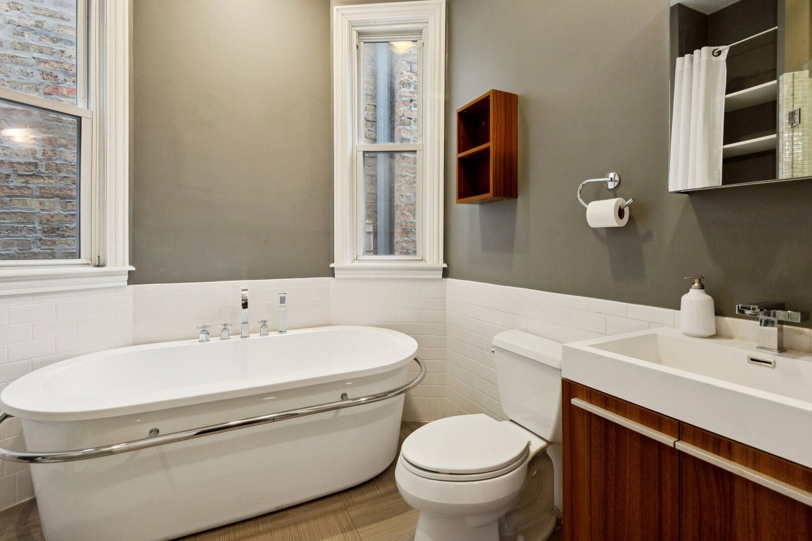 903 West Addison Street, Unit 1 Chicago, IL 60613 - Photo 18 of 25 a bathroom with a sink toilet and mirror