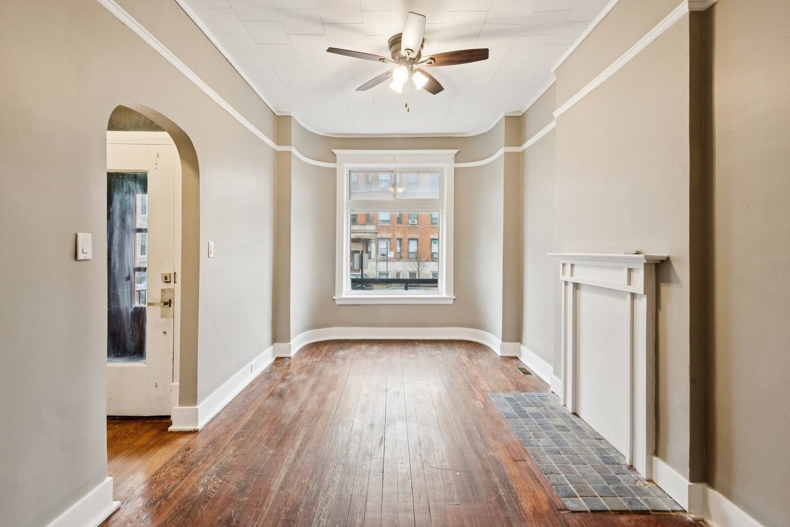 903 West Addison Street, Unit 1 Chicago, IL 60613 - Photo 2 of 25 a view of hallway with a large window and wooden floor