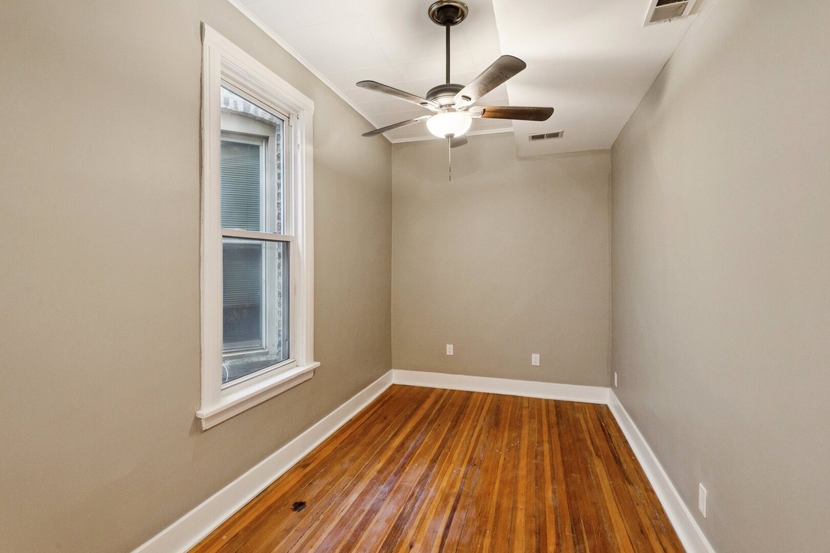 903 West Addison Street, Unit 1 Chicago, IL 60613 - Photo 21 of 25 a view of a room with wooden floor closet and chandelier fan