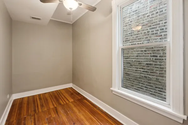 a view of wooden floor with a window