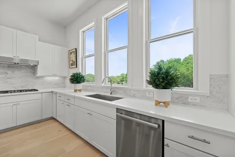 a kitchen with a sink and a window