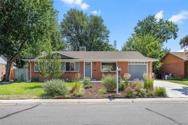 front view of a house and a small yard