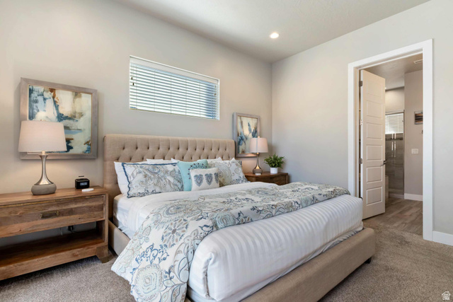 2600 Ocotillo Way, Unit 31 Santa Clara, UT 84765 - Photo 17 of 73 Carpeted bedroom featuring a low-profile window with blinds, recessed lighting, and a neutral color palette