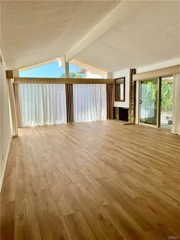 a view of an empty room with windows