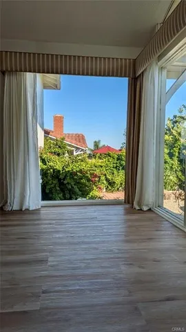 a view of a back yard from a room