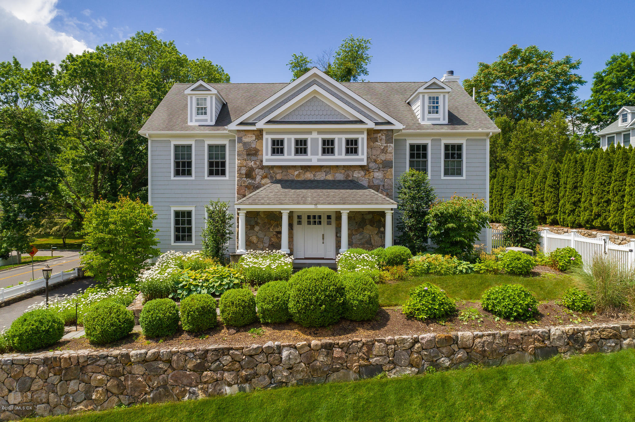 15 Old Orchard Road Riverside, CT 06878 - Photo 1 of 26 a front view of a house with a yard