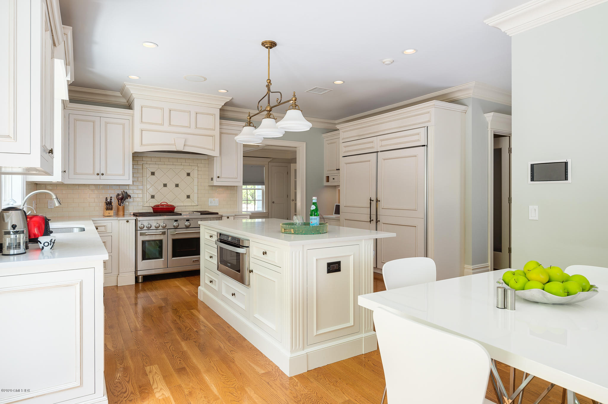 15 Old Orchard Road Riverside, CT 06878 - Photo 7 of 26 a kitchen that has a lot of cabinets a sink and appliances