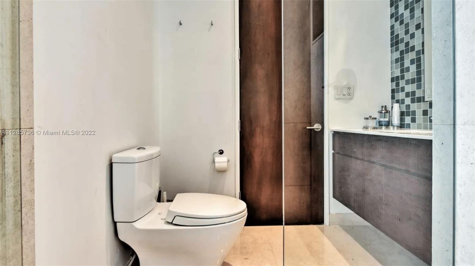 Keystone Point North Miami, FL 33181 - Photo 11 of 26 a bathroom with a toilet and a shower