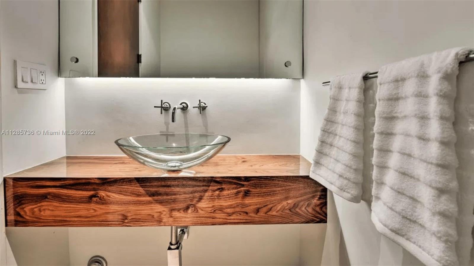Keystone Point North Miami, FL 33181 - Photo 12 of 26 a bathroom with a granite countertop sink a mirror and shower