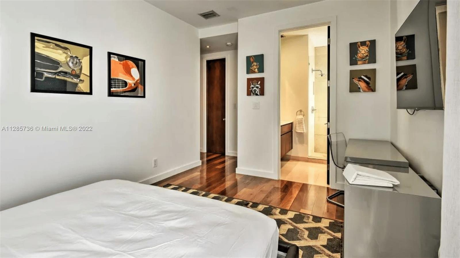 Keystone Point North Miami, FL 33181 - Photo 13 of 26 a bedroom with a bed and a couch