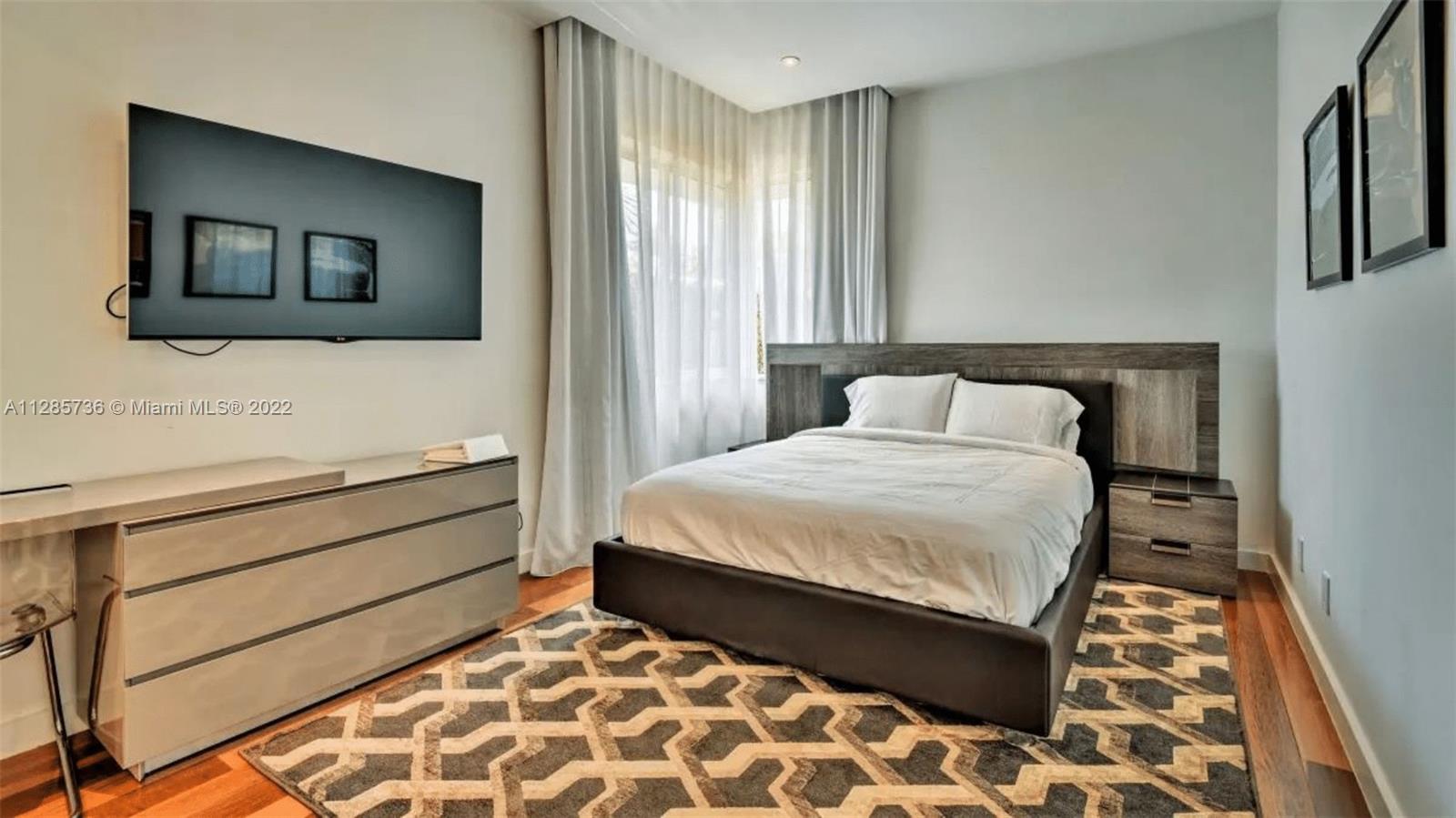 Keystone Point North Miami, FL 33181 - Photo 14 of 26 a bedroom with a bed and a window