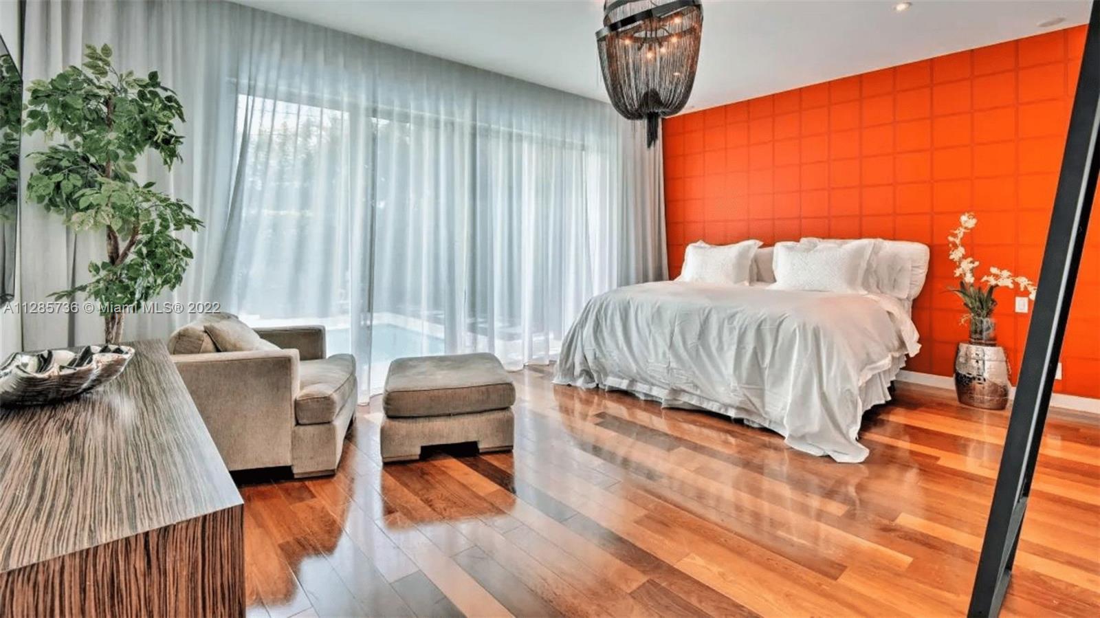 Keystone Point North Miami, FL 33181 - Photo 16 of 26 a bedroom with furniture and a large window