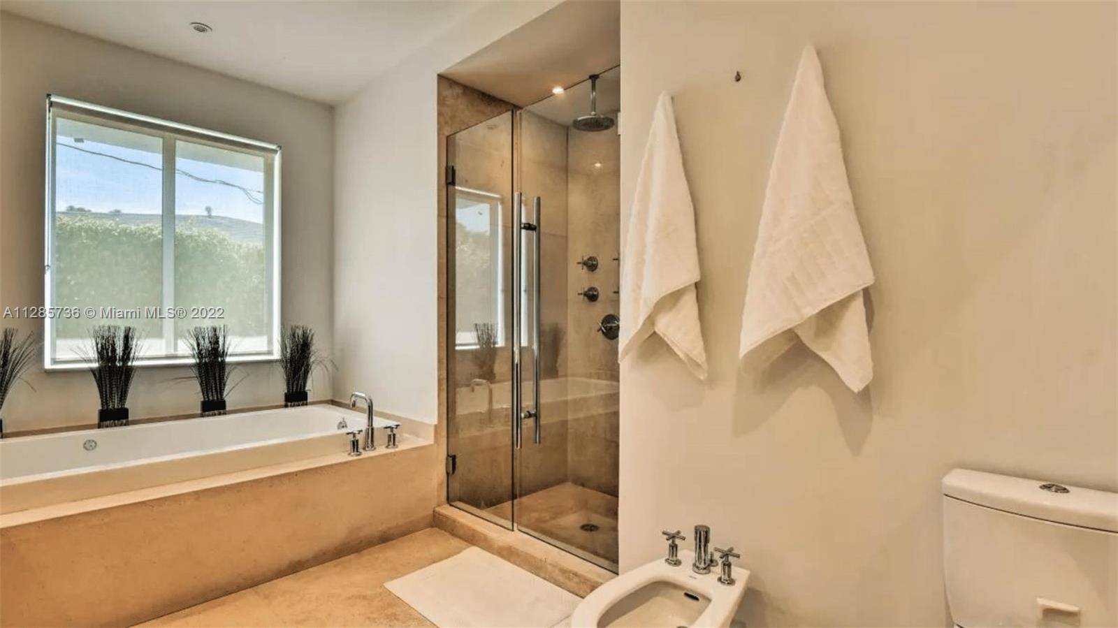 Keystone Point North Miami, FL 33181 - Photo 21 of 26 a bathroom with a bathtub and a shower