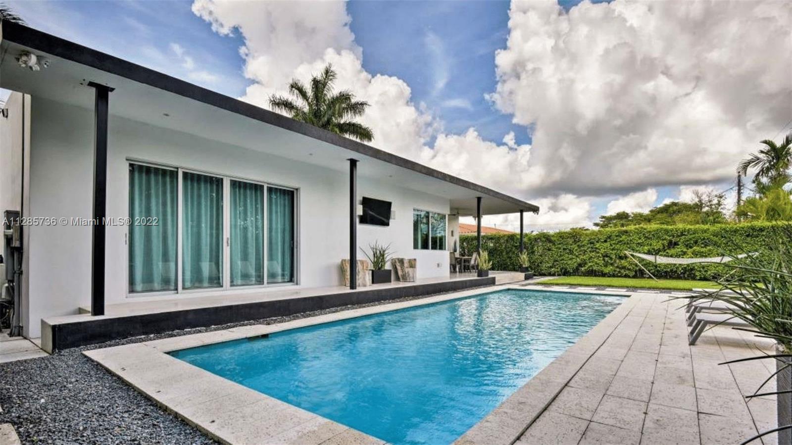 Keystone Point North Miami, FL 33181 - Photo 24 of 26 a view of a patio with swimming pool table and chairs