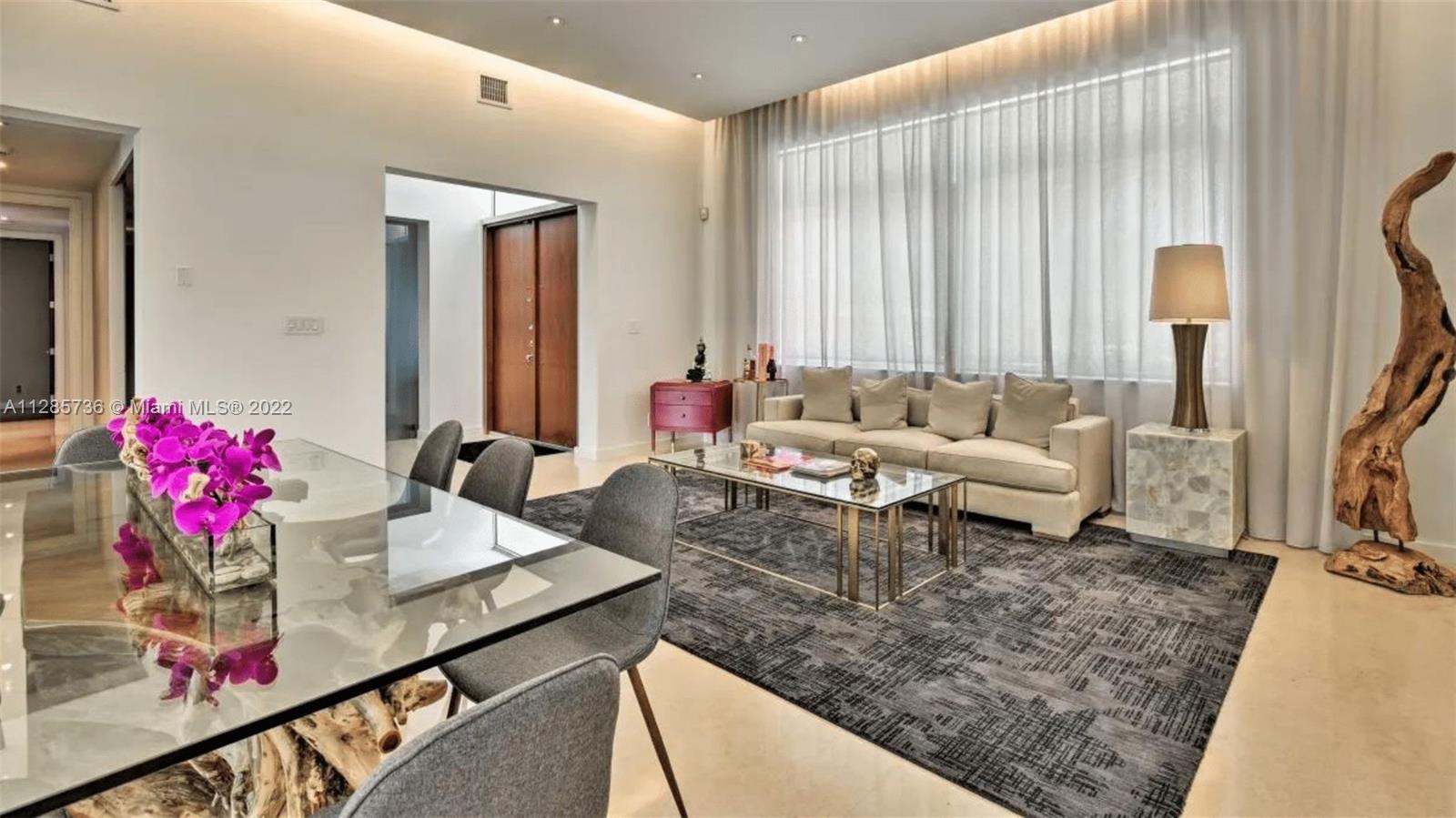 Keystone Point North Miami, FL 33181 - Photo 4 of 26 a living room with furniture and flowers