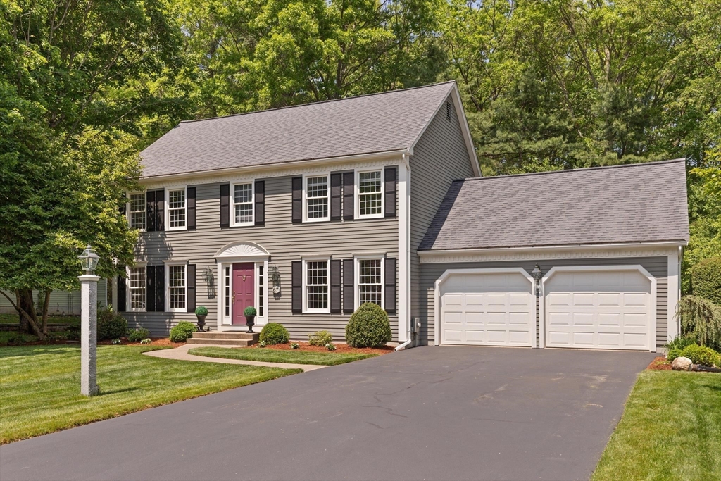 67 Bridle Path Franklin, MA 02038 - Photo 3 of 35 front view of a house with a yard