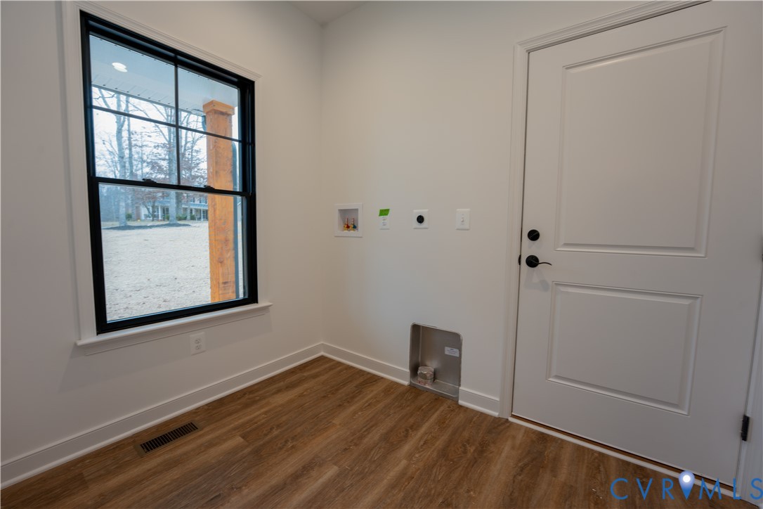 5512 Hickory Ridge Road Spotsylvania, VA 22551 - Photo 12 of 22 a view of an empty room with wooden floor and a window