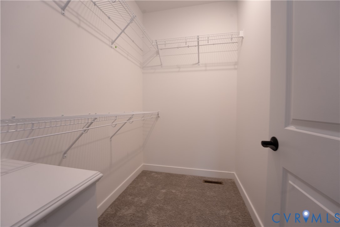 5512 Hickory Ridge Road Spotsylvania, VA 22551 - Photo 15 of 22 a view of a room with racks on the wall